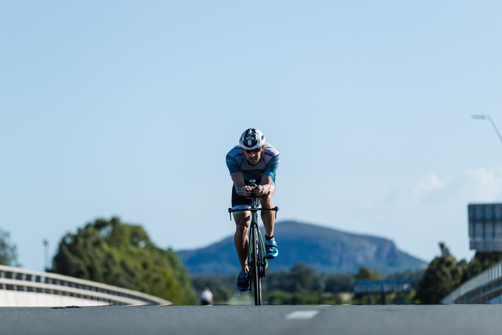 Eddie on a time trial bike, head down on the aero bars